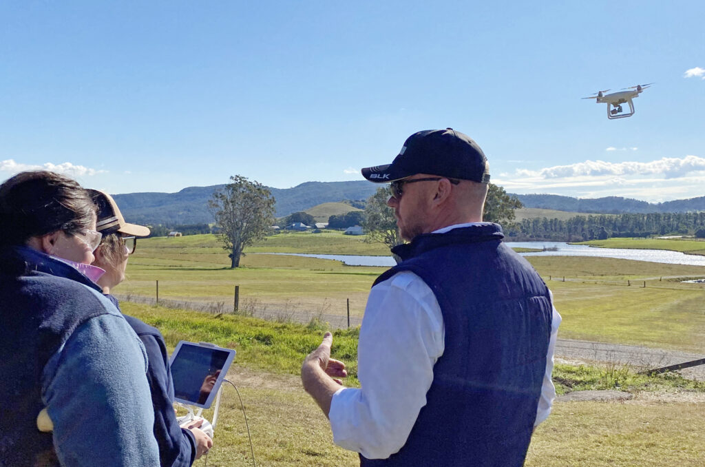 Man Training Students in Drones